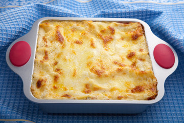 classic lasagna over blue cloth