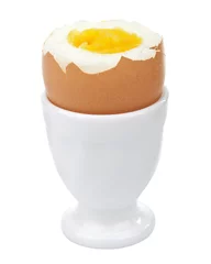 Foto op Canvas boiled egg in egg cup isolated © Olga Miltsova