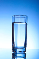 Three Glasses of water on blue background