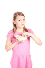 Portrait of a little girl with popcorn on white