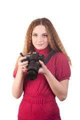 Young woman posing with professional photo camera