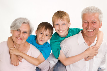 Happy smiling grandparents with their grandsons