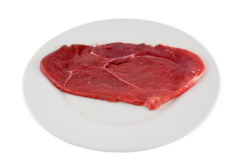 Raw beef schnitzel. Isolated, contains clipping path.