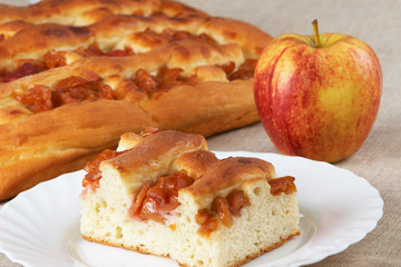 Homemade pie with apples and an apple