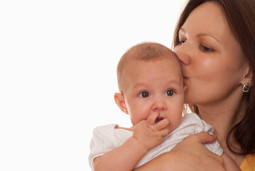 mother in yellow holding newborn