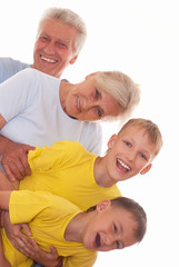 smiling grandparents with grandsons