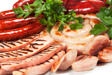 Grilled sausage with sauce and vegetables