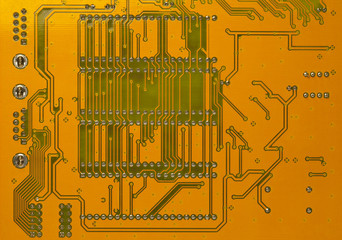 Computer circuit board in orange and green