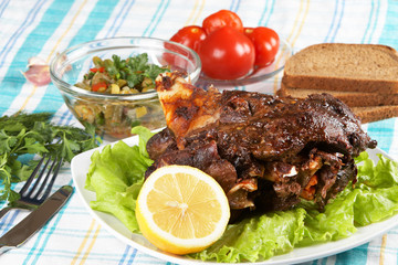 Roast leg of lamb on decorated table