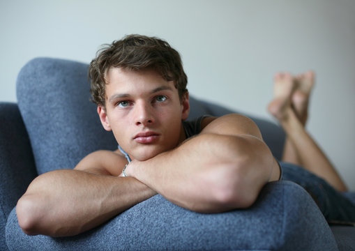 Young Sexy Man on a Sofa