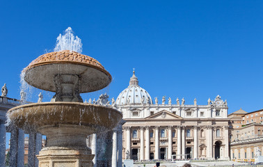 Fototapeta premium Vatican.A fountain before St. Peter's Cathedral