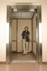 Fototapeta premium Woman In An Elevator