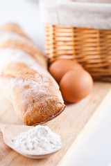 bread, flour, eggs and kitchen utensil