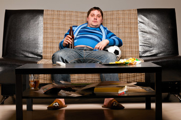 soccer fan on sofa