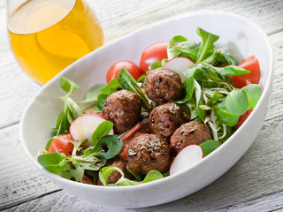 mixed salad with vegetarian meatballs slice radish and  soy spro