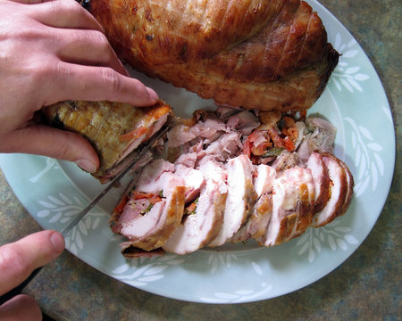 Cutting A Stuffed Chicken Roll, And Pork Roll Closeup