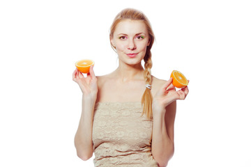Young woman with oranges in her hands