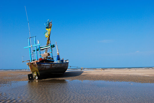 fisherman boat on the sea shore