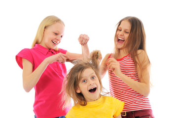 Fototapeta na wymiar Girls playing a hairdressing salon