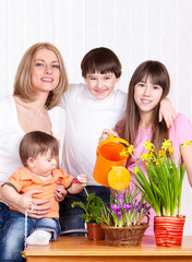 Family watering flowers