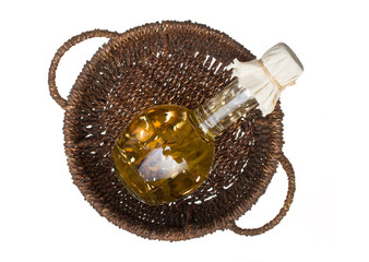 Obraz na płótnie Canvas Bottle of vegetable oil in a basket
