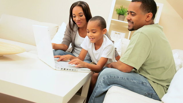African American Family Sharing a Laptop