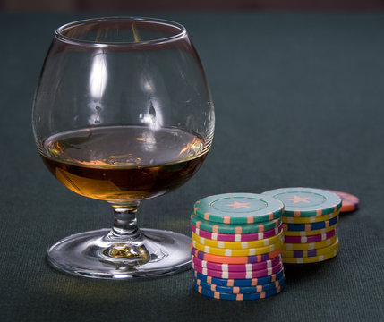 Glass with cognac and chips