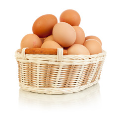 Eggs in basket isolated on white