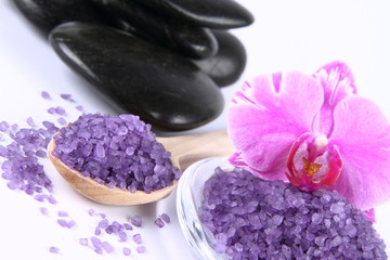Fototapeta na wymiar Lavender spa salt, spa stones and an orchid flower