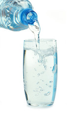 Bottle and glass of water isolated on white