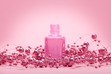 Nail polish on pink background