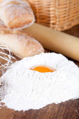 Obraz na płótnie Canvas bread, flour, eggs and kitchen utensil