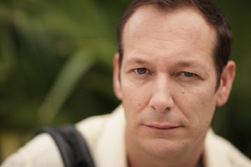 Image of a man squinting his eyes