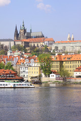 Obraz premium View on the spring Prague gothic Castle above River Vltava