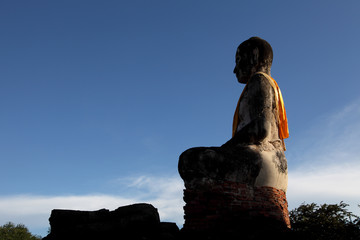 Sitting Buddha with Blue Sky Background
