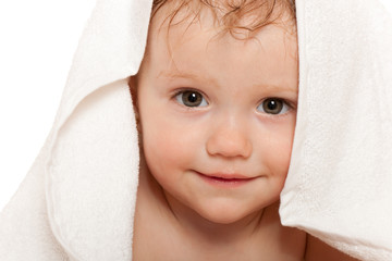 Closeup portrait of little girl in the white towel