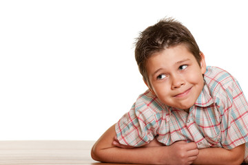 Fototapeta premium Cheerful boy lying on the floor