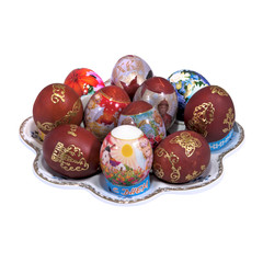 nice plate and different painting decorated Easter eggs closeup