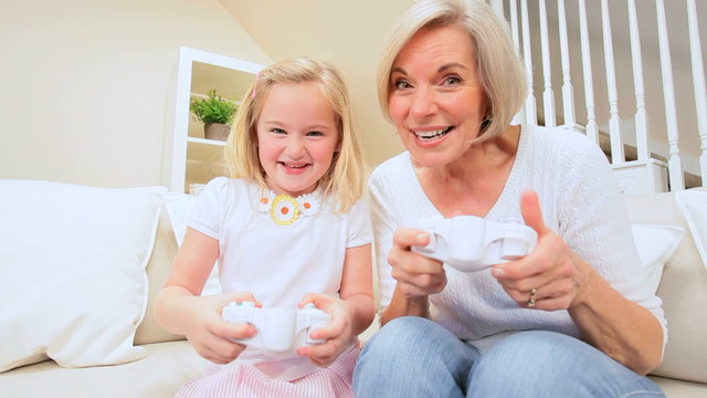 Cute Little Girl & Grandma on Games Console