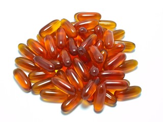 Lecithin gel capsules on white background