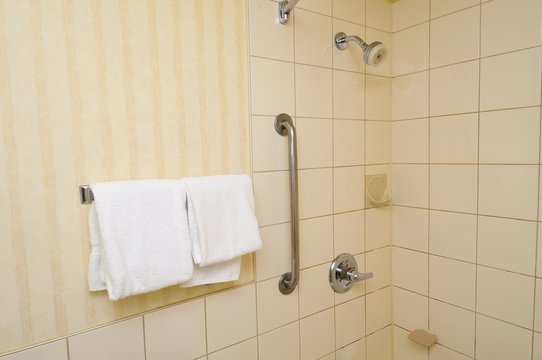Towels hanging beside shower