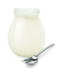 Isolated yogurt. Open glass jar of natural fresh yogurt and a spoon isolated on white background