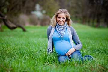 Fototapeta premium Pregnant woman outdoor spring time