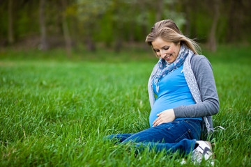 Fototapeta premium Pregnant woman outdoor spring time