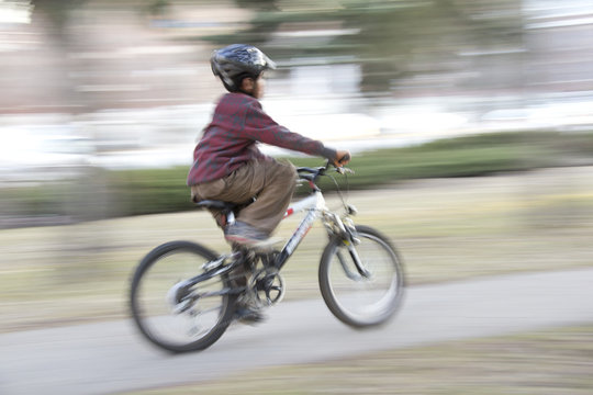 Young boy riding a bike