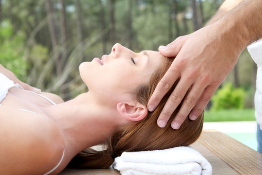 Beautiful woman having a head massage