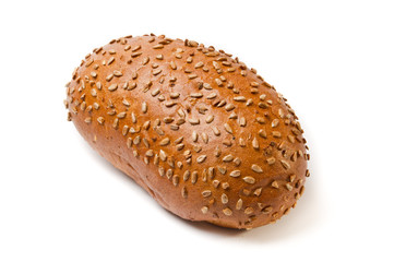 Dark brown coarse grinding bread loaf with sunflower seeds