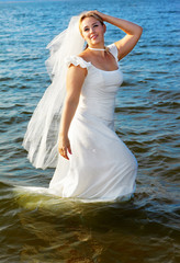 Fototapeta na wymiar bride walking in sea