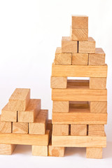 Stack of wooden rectangular blocks on white background