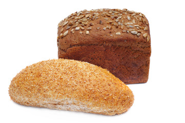two ruddy loafs of bread with sunflower seeds